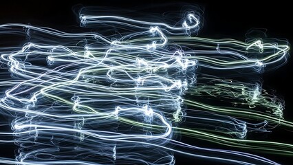 Dynamic electric light trails creating an abstract energy flow in a dark space with vibrant patterns