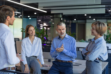 Group of happy progressive business people working on startup together at creative office