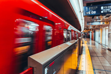 Shinjuku Station platform, Tokyo, Japan. Train arriving