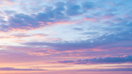 Obraz premium Beautiful Pink and Blue Sunset Sky With Scattered Clouds