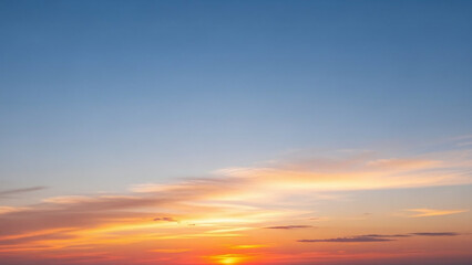 Obraz premium Bright Orange and Pink Sunset Horizon with Blue Sky