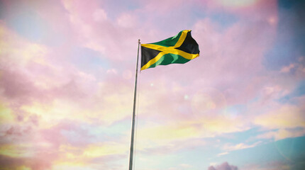 The Jamaican flag stands out against a pastel sky, ideal for representing national pride in travel brochures or cultural events.