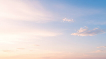 Obraz premium Soft pastel sky with wispy clouds at dawn sunrise