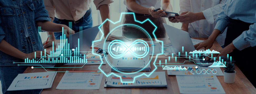 A business team engages in collaboration, surrounded by technology visuals, data analysis charts, and coding elements. Ideal for concepts of innovation and teamwork. Trope - Powered by Adobe