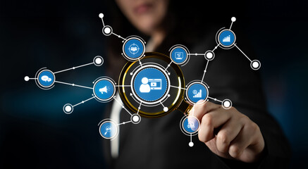 A businesswoman interacts with a digital interface, showcasing data visualization and technology icons. The image illustrates growth strategies and network connections in a finance context. Crux