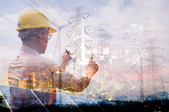 Engineer with hard hat standing against a double exposure background of city lights, solar panels, and wind turbines, symbolizing future energy technology and urban power systems.