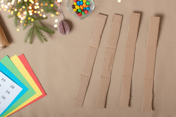 The triangles of the Advent calendar are made of thick cardboard. Step-by-step instructions. Step 2 cut the strips