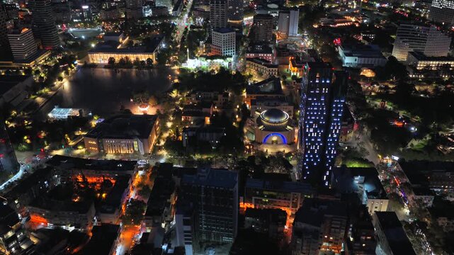 Night aerial video of Tirana showcasing urban streets glowing city lights. 