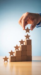 Hand placing star on wooden blocks for rating