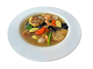 Authentic Thai Rad Na Talay: wide rice noodles topped with thick, savory gravy, mixed seafood, and crisp vegetables, isolated on white