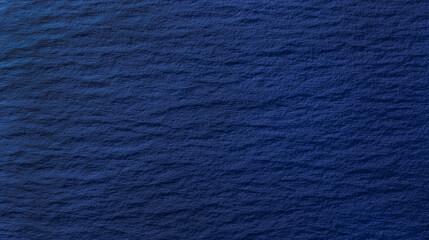 深みのある紺色の紙のテクスチャ背景