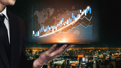 A businessman presents a modern growth chart on a laptop against a stunning cityscape background. The image symbolizes financial success and analytics, ideal for business and finance themes. Impute