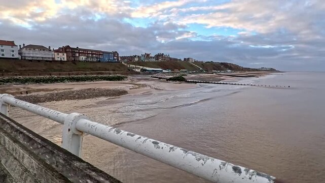 View of Cromer beach and seafront on the North Norfolk Coast. Captured from the Victorian pier on a cold and late afternoon in December