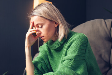 Middle age Sad Woman at Home