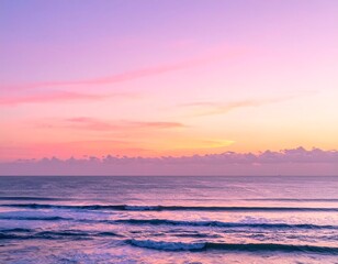 Serene ocean scene at sunset, showcasing vibrant pinks, oranges, and soft blues. Gentle waves meet the horizon