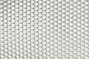 Geometric metal tile pattern with repetitive diamond shapes in grayscale texture Demonstration Color of the Year 2026
