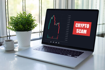 computer laptop with chart scam crypto coins on screen office
