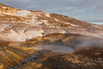 Snow covered geothermal hills at Seltun Krysuvik in Iceland.