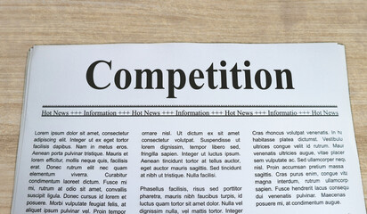 A newspaper with the headline Competition