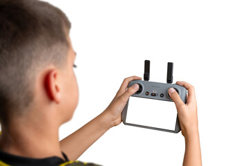 Boy holding a drone controller with blank screen, ideal for UI mockups, app design previews, or technology product presentations © Stanisic Vladimir