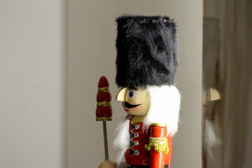 Image of a nutcracker soldier figurine photographed indoors in Novi Sad on December 6, 2025. Traditional holiday decor captured in soft light.