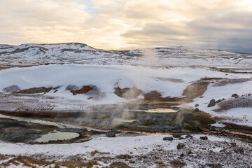 Steaming geothermal pools in snowy Seltun Krysuvik Iceland, Iceland.