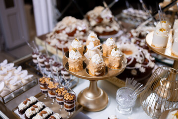Delicious variety of desserts displayed at an elegant event in a beautifully arranged setting