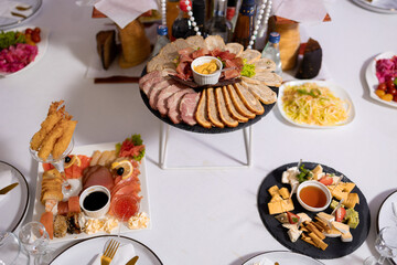Delicious assortment of appetizers displayed on elegant dining table for special event