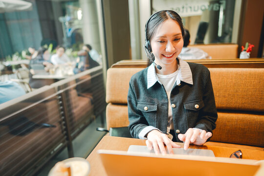 Portrait young adult beautiful business woman wearing headset work at cafe confidence smiling communication - Powered by Adobe