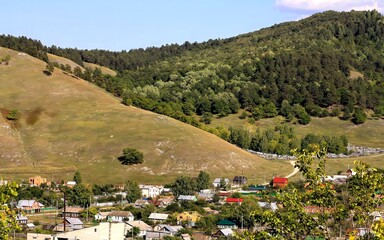 old russian village shiryaevo on the bank of the river volga zhigulevskie mountains on a summer day