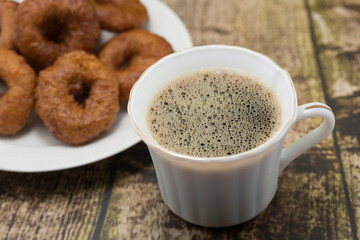 Coffee and Donuts on a Rustic Wooden Table