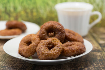 Coffee and Donuts on a Rustic Wooden Table
