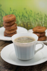 Coffee and Donuts on a Rustic Wooden Table
