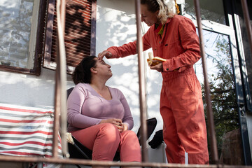 married couple same sex having breakfast on terrace, lifestyle people concept