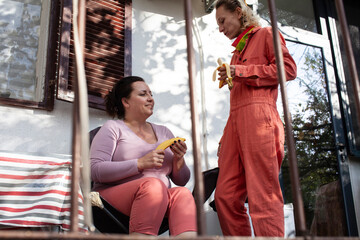 married couple same sex having breakfast on terrace, lifestyle people concept
