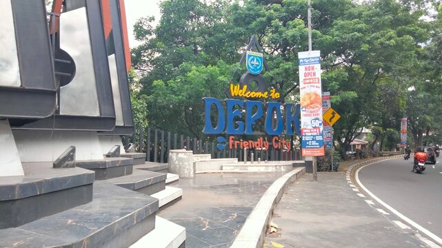 Depok, Indonesia - December 11 2025: train on the railway, traffic in the city, traffic in the city, parking sign on the road, parking sign on the wall, parking sign on the street