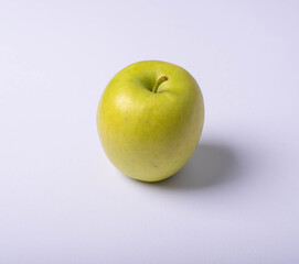 Closeup of Granny Smith apple on white background. Nobody.