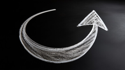 a white curved arrow drawn with chalk on black background