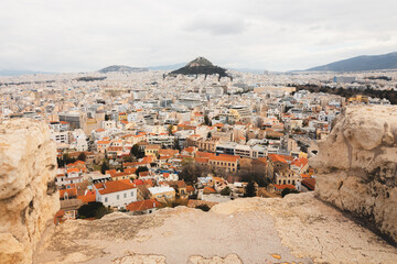 Cityscape view over the sprawling city of Athens, Greece and Lycabettus Hill from the Acropolis.