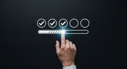 Finger pressing a loading bar with completed checkmarks, symbolizing progress and completion.