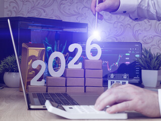 Visual representation of 2026 investment planning with gold, bitcoin, real estate, and financial data pointing toward strategic growth.