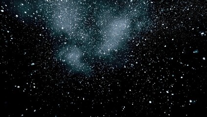 A dark expanse filled with glowing dust clouds and countless sparkling stars filling most of the frame