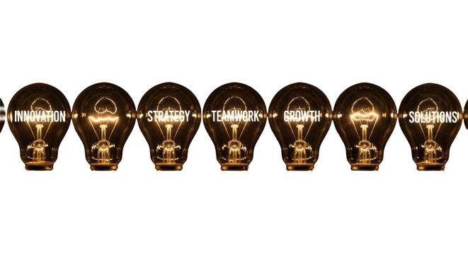 Row of incandescent bulbs, glowing warmly with business words, against a deep black studio background with negative space, concept of innovative business strategy