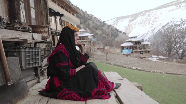 Portrait Young Kalashi Woman, Beautiful Traditionally Dressed girl in in Bumburet Valley at Winter, Chitral, Pakistan.
