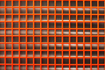 Metallic heat exchanger or industrial radiator core fins, showing the dense, vertical rows of cooling elements and the mechanical structure for thermal regulation in machinery