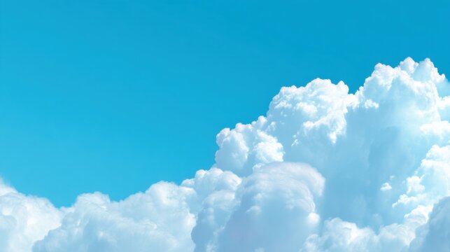 White fluffy clouds gather in the bright blue sky during midday. The scene shows no signs of rain and the sunlight brightens the clouds.