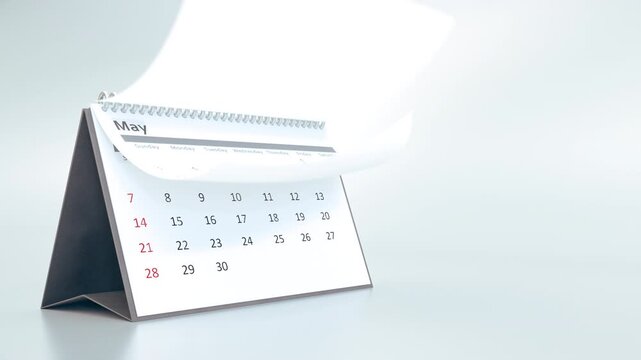 Desktop calendar animation with pages turning rapidly, showing the passing of a full year. Concept of time, deadlines, and schedules on a clean white background.