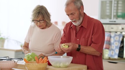 Mature couple working together in home kitchen, carefully peeling fresh apples while sharing joyful moment of meal preparation and healthy eating