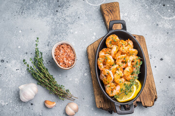 Ready-to-eat pan-seared shrimp (prawns) with fresh herbs, positioned for an advertisement or a clean, modern food magazine layout.