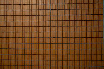 Wood background banner panorama long - Brown wooden acoustic panels wall texture , seamless pattern, vertical